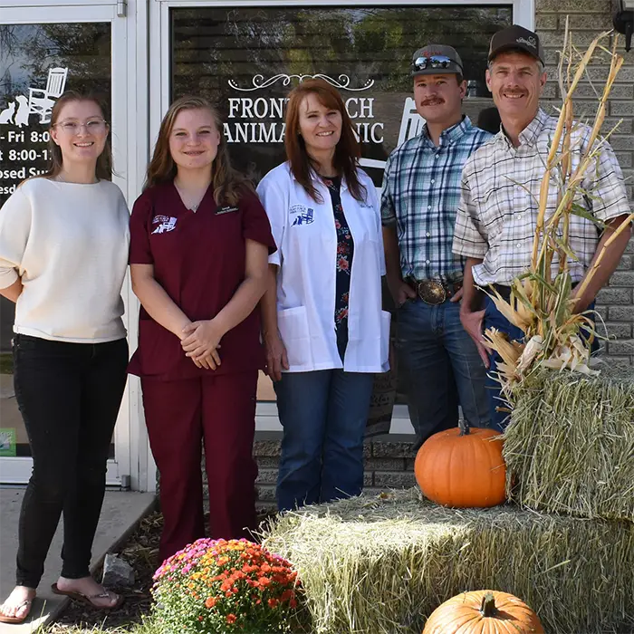 Dr. Gabel and her family standing in front of the Front Porch Animal Hospital doors.